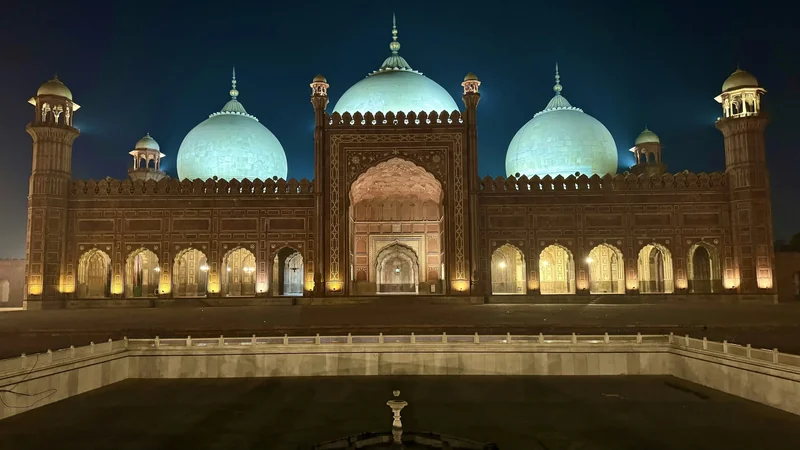 Badshahi Mosque illuminated against Lahore’s night sky